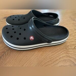 Lightly used , in great condition CROCS Black and White Men/ women’s Clogs